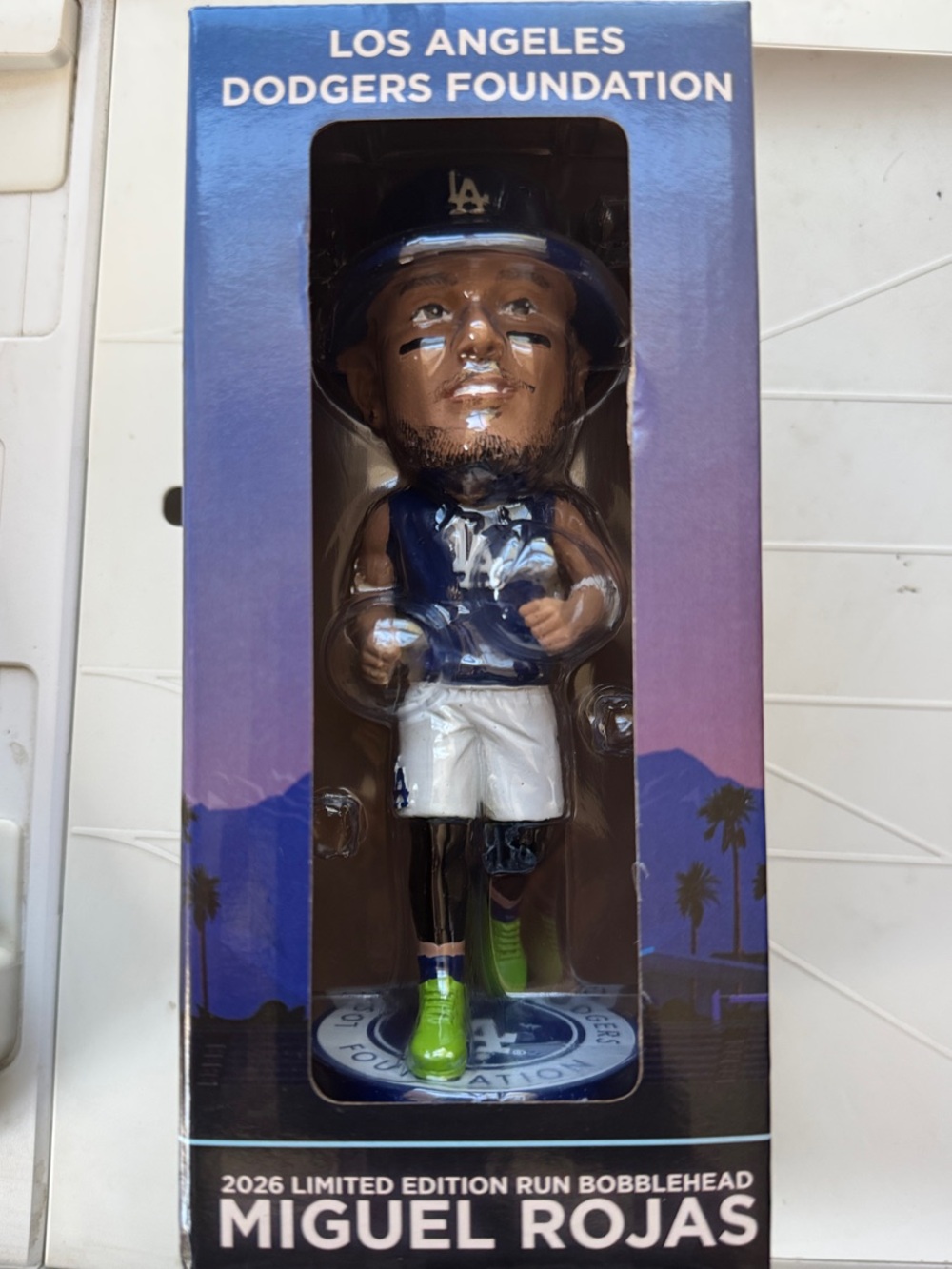 Uniqlo Navy and White Los Angeles Figurine with Green Accents